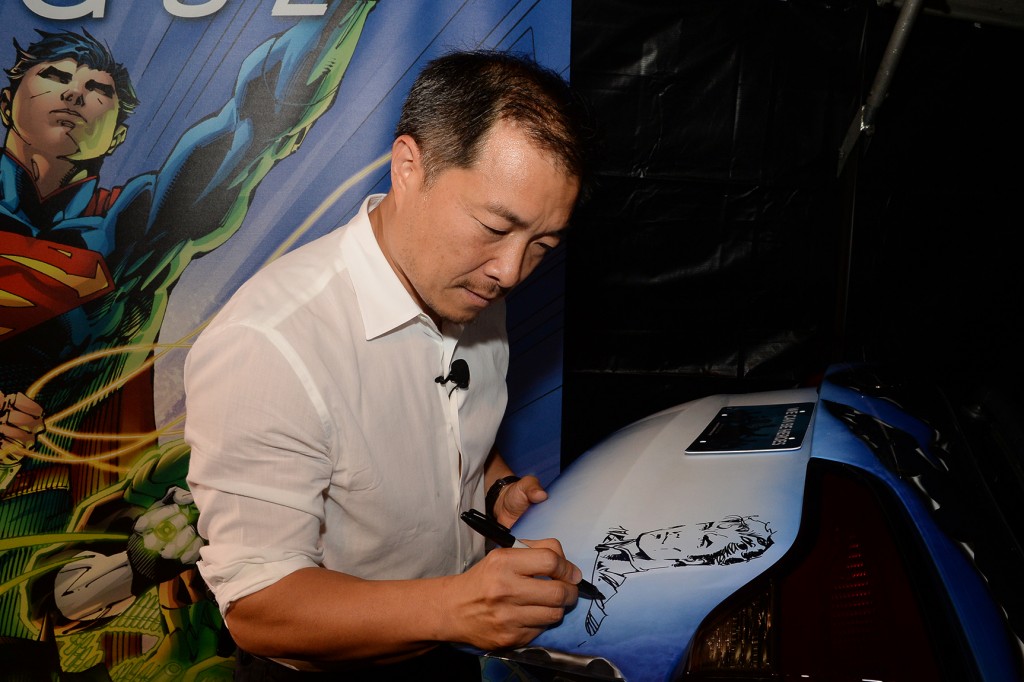 Jim Lee (creator and co publisher of DC Entertainment) customizes the JUSTICE LEAGUE-inspired Kia Sorento, the eighth and final custom vehicle built in partnership with Kia Motors America, which benefits the "We Can Be Heroes" campaign on July 17, 2013.